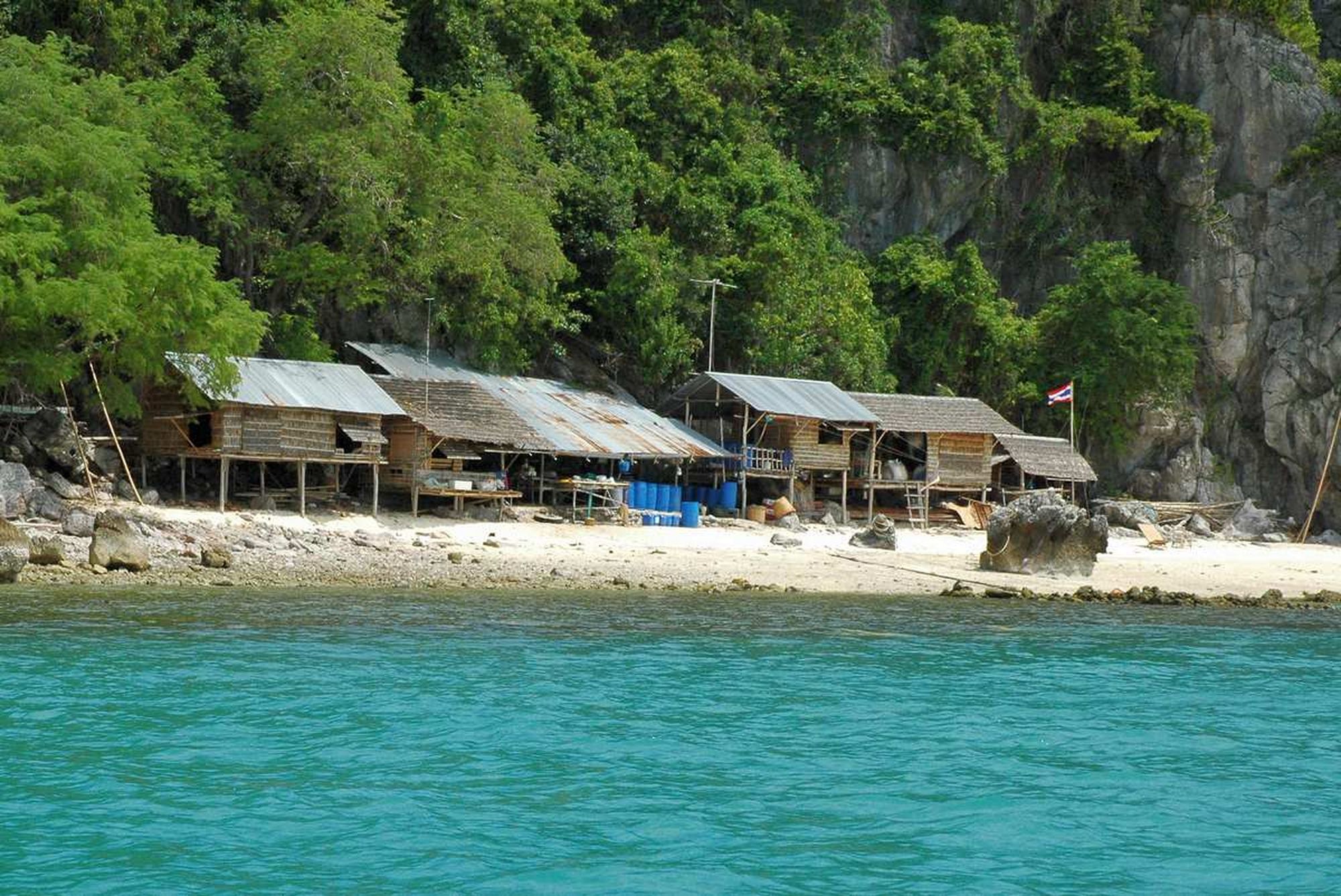 One of the Five Islands is home to a sandy beach with bungalows.
